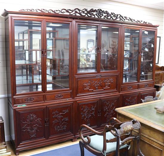 A Chinese rosewood cabinet in three parts W.305cm